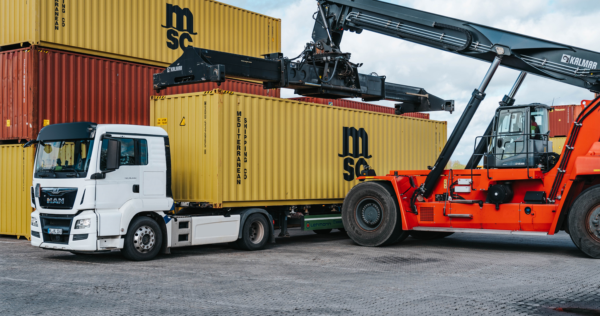 Aerial view of container cargo ship in sea.